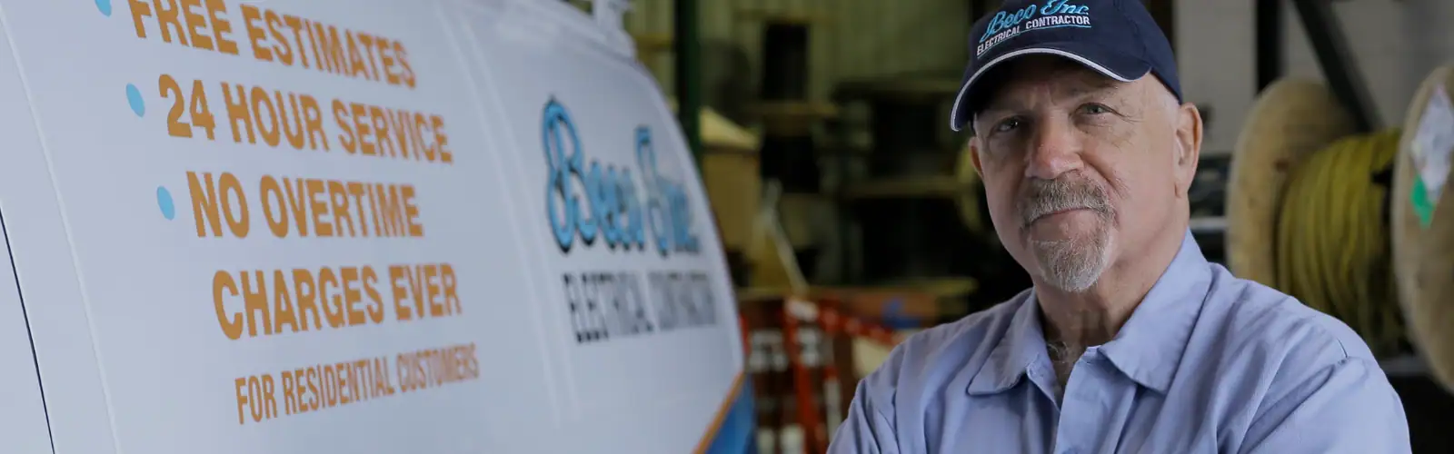 Beco electrician beside service van